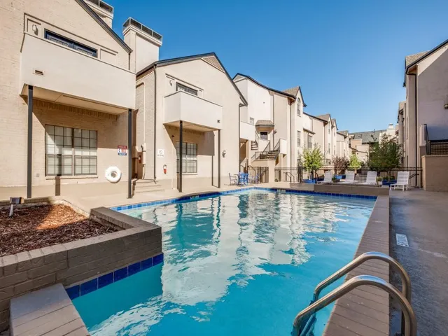 a view of a balcony with chair and table