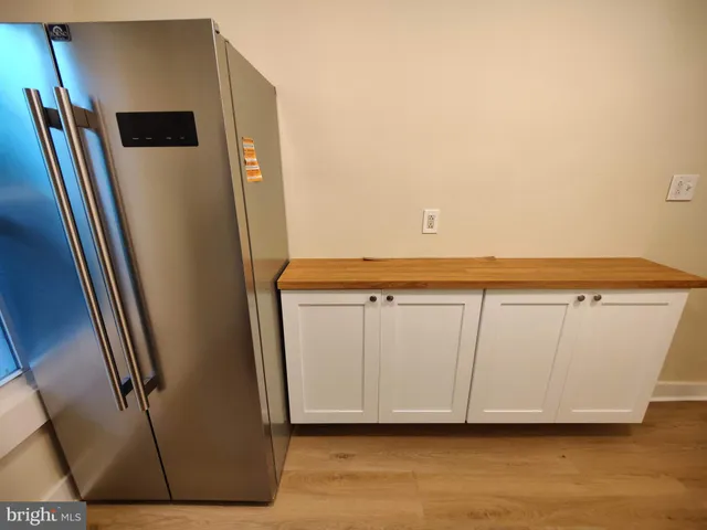 a view of a refrigerator in kitchen and a refrigerator