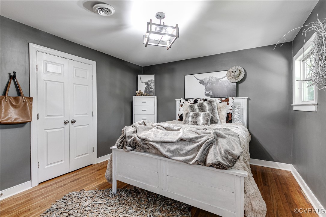 6737 Rural Point Road Mechanicsville, VA 23116 - Photo 11 of 32 Bedroom with a closet and hardwood / wood-style fl