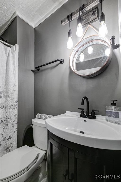 6737 Rural Point Road Mechanicsville, VA 23116 - Photo 13 of 32 Bathroom with toilet, vanity, and ornamental moldi