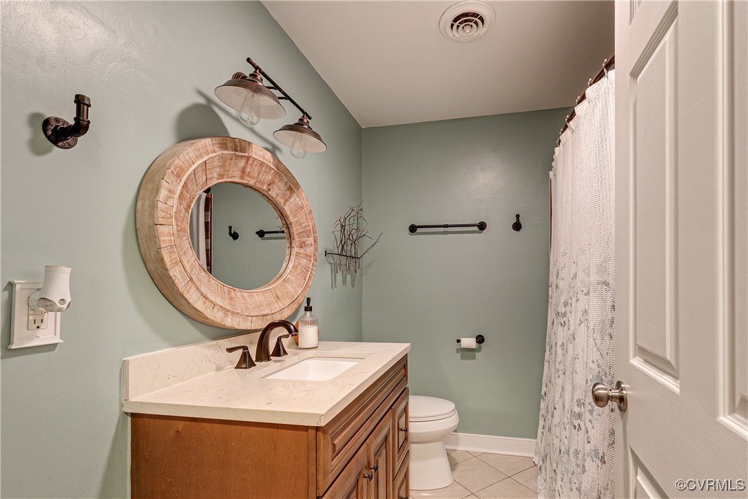 6737 Rural Point Road Mechanicsville, VA 23116 - Photo 17 of 32 Bathroom with vanity, tile patterned flooring, and