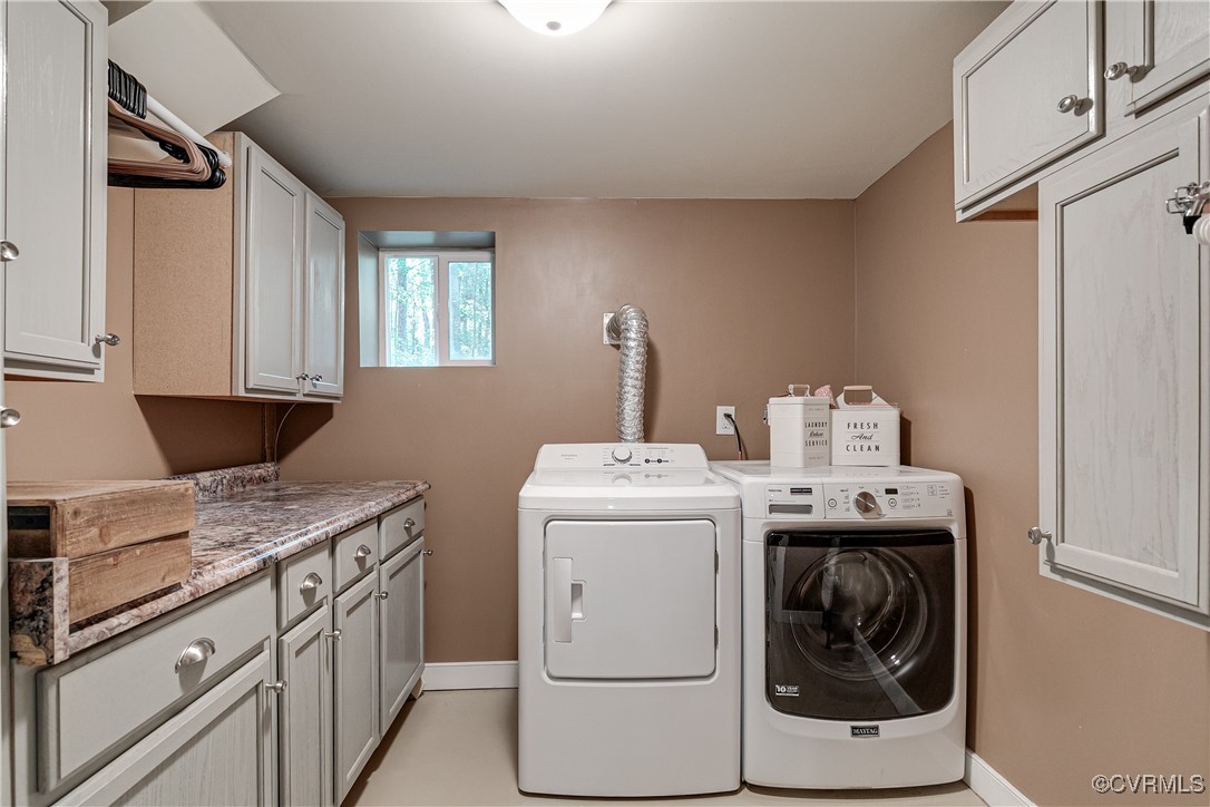 6737 Rural Point Road Mechanicsville, VA 23116 - Photo 29 of 32 Washroom with washer and dryer and cabinets