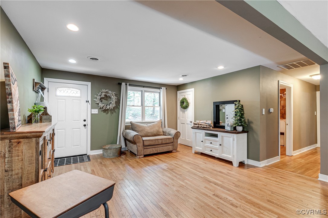6737 Rural Point Road Mechanicsville, VA 23116 - Photo 7 of 32 Living room with light hardwood / wood-style floor
