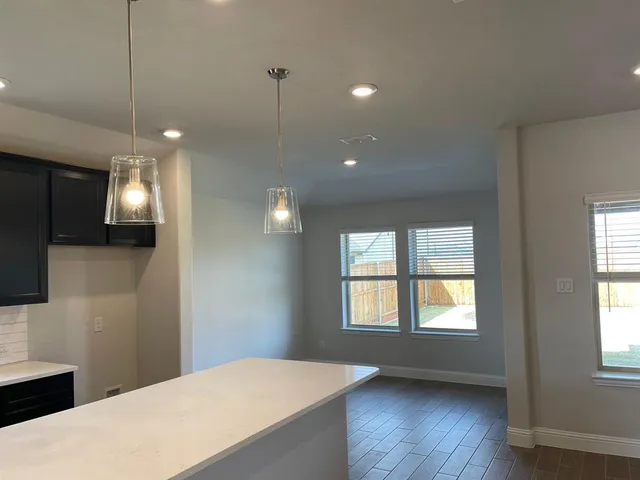 a view of a room with window and wooden floor