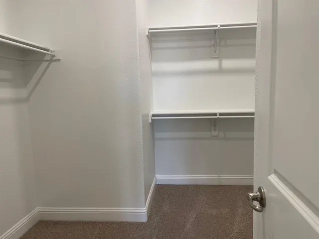 a view of an empty walk in closet