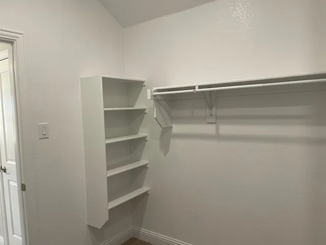 a view of an empty walk in closet