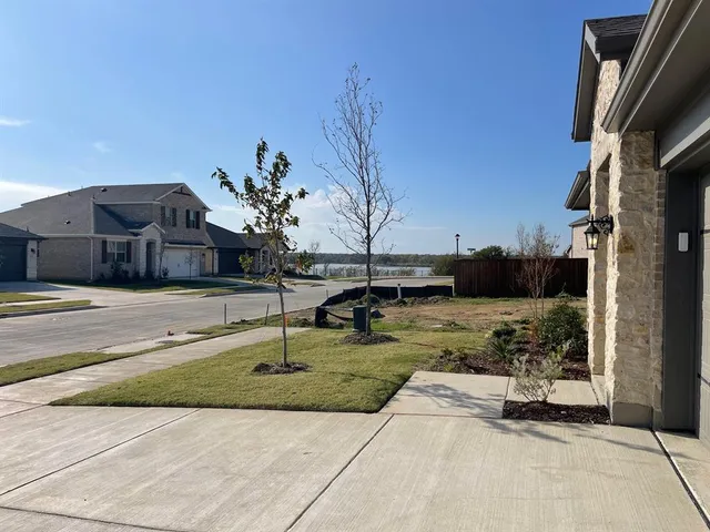 a view of a street with a building in the background