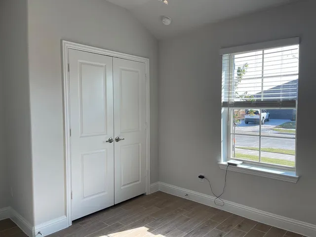 a view of an empty room with a window