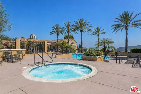 a view of a park with tall trees