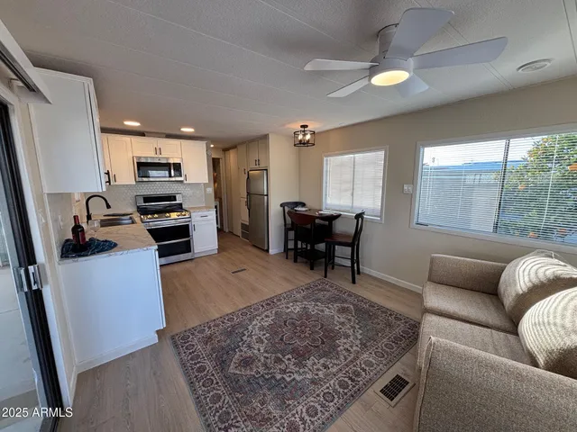a living room with furniture and a rug