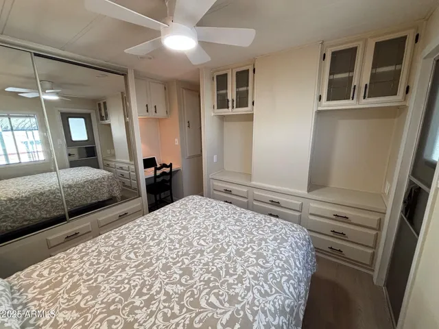 a bedroom with bed and window