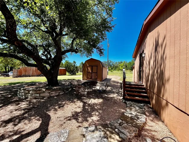a view of a back yard of the house