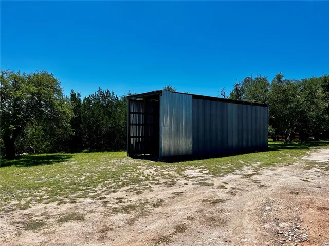 a view of backyard with green space