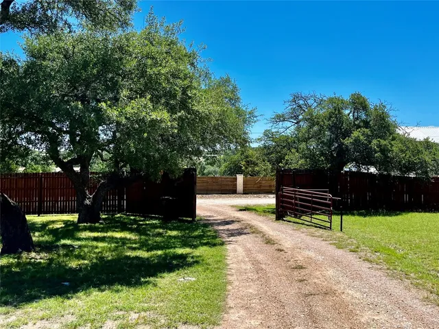 a wooden bench sitting in the garden