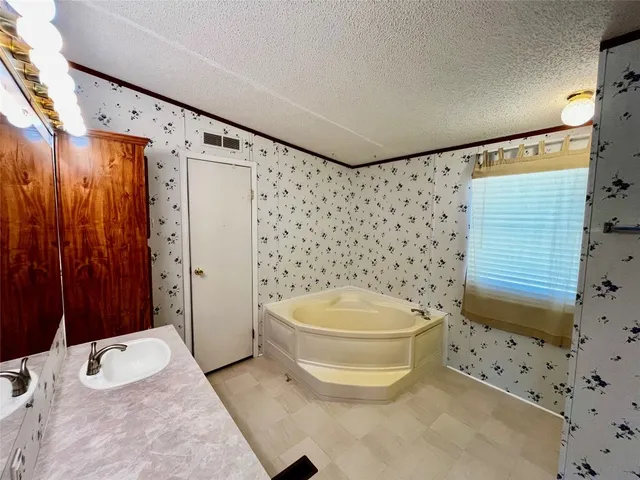 a bathroom with a toilet sink and shower