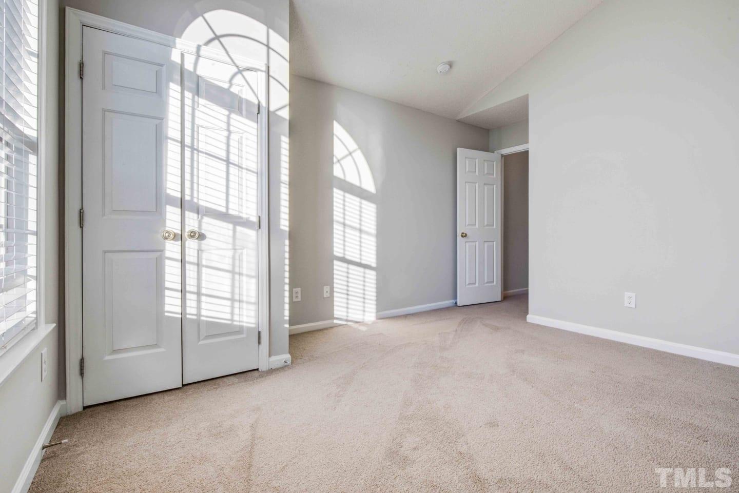 2101 Blackwolf Run Lane, Unit 5609 Raleigh, NC 27604 - Photo 14 of 19 an empty room with windows and chandelier