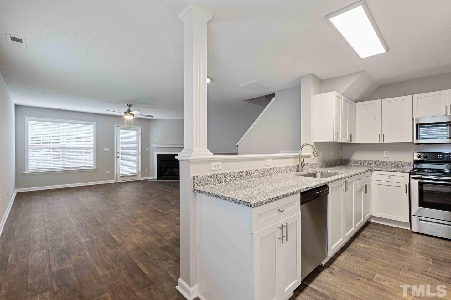 2101 Blackwolf Run Lane, Unit 5609 Raleigh, NC 27604 - Photo 8 of 19 a kitchen with a sink stove and cabinets