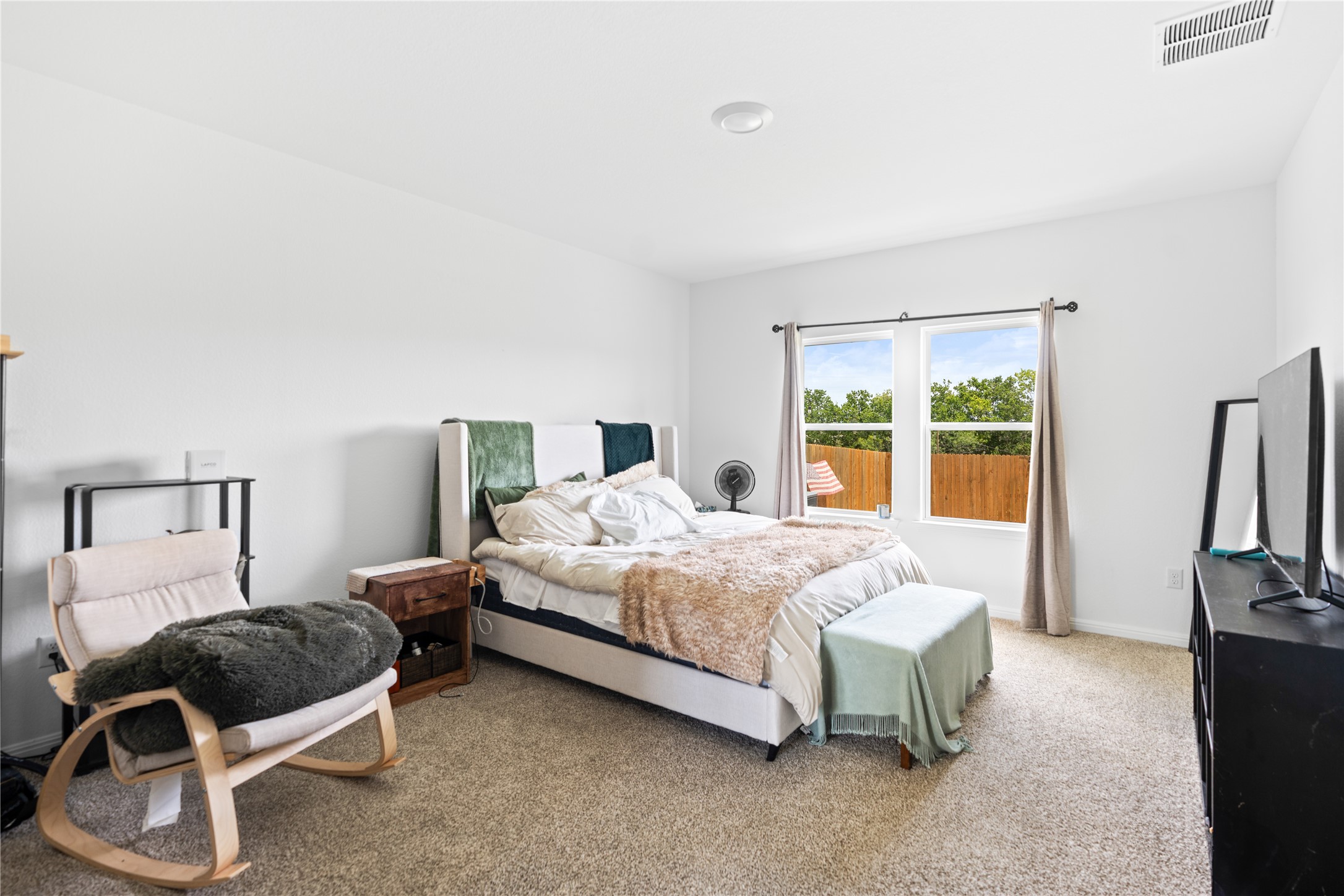 143 Santa Rosa Lane Buda, TX 78610 - Photo 14 of 28 Bedroom with light carpet