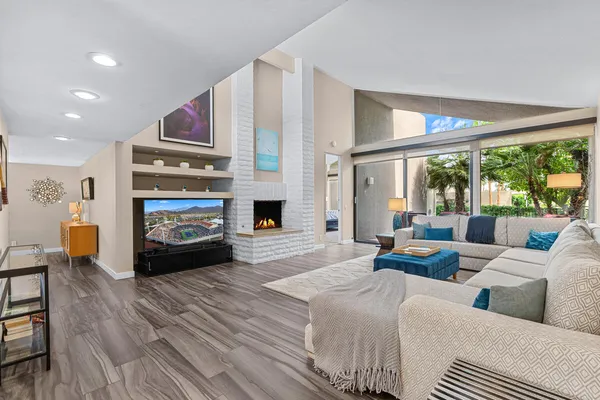 a living room with furniture and a fireplace