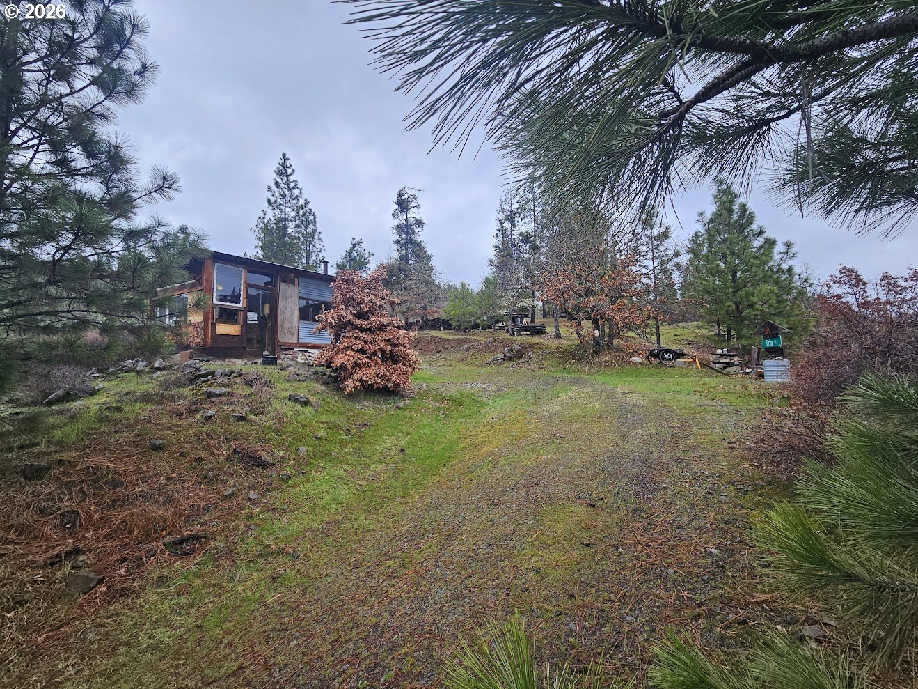 Wahkiacus Heights Road Klickitat, WA 98670 - Photo 34 of 42 a view of a house with a yard