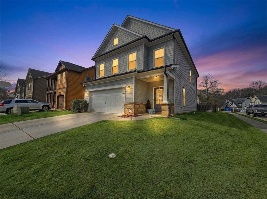 7281 Silk Tree Pointe Braselton, GA 30517 - Photo 1 of 1 a front view of a house with a yard