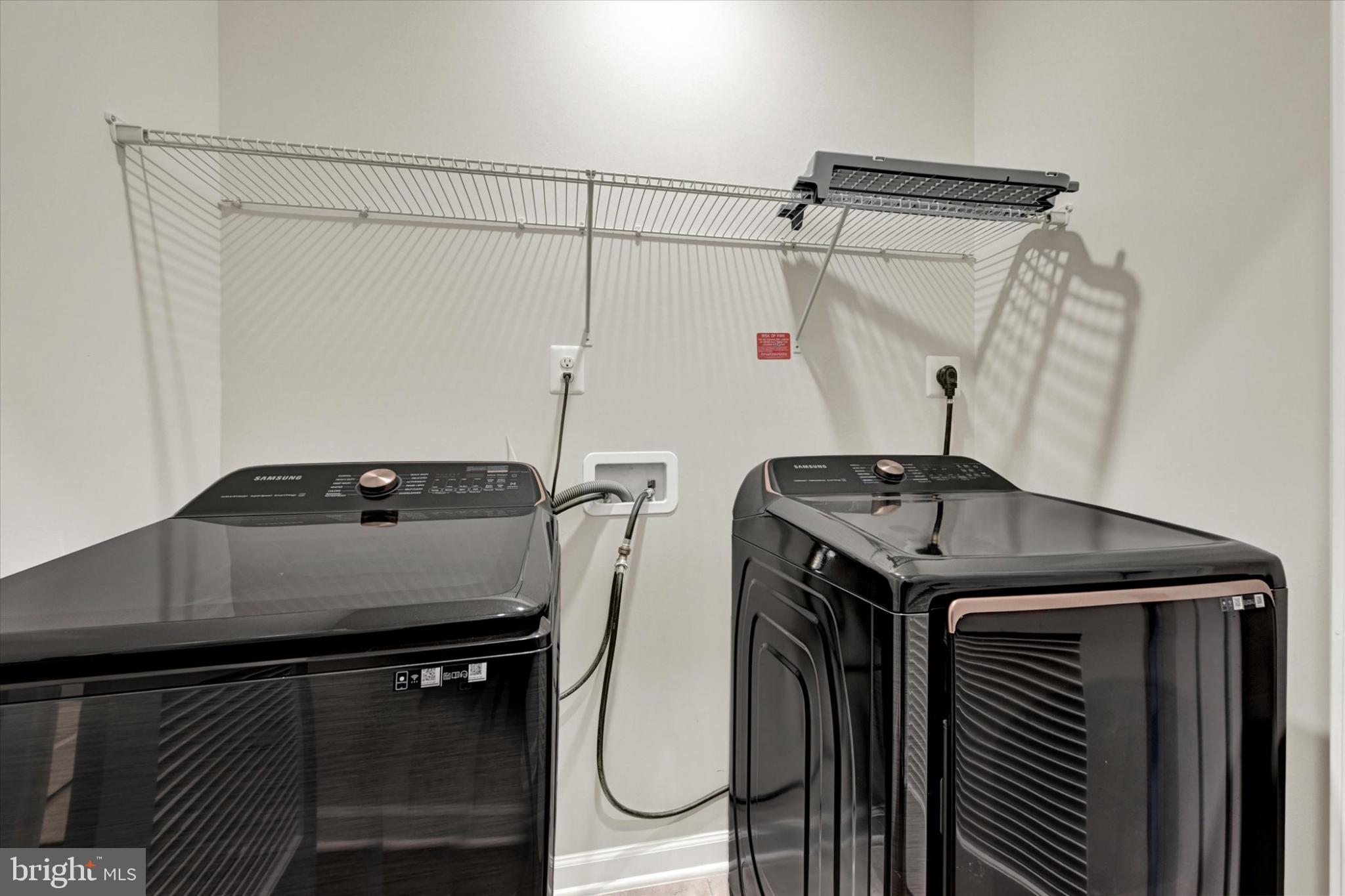 1729 Mill Branch Drive Laurel, MD 20708 - Photo 26 of 28 Sleek laundry space with modern appliances.