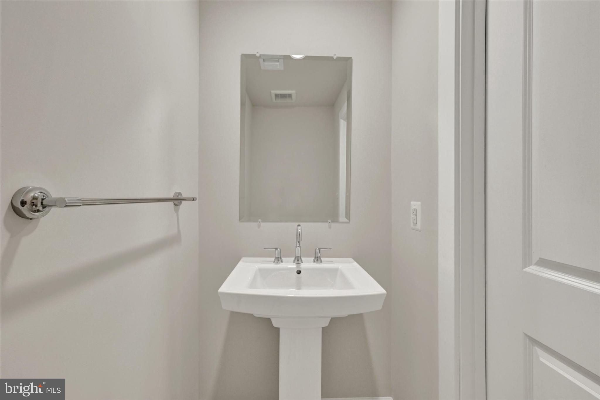 1729 Mill Branch Drive Laurel, MD 20708 - Photo 7 of 28 Sleek and modern powder room design.