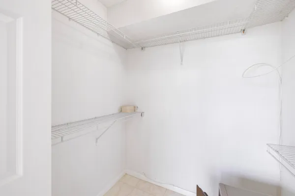 a bathroom with a granite countertop sink toilet a mirror and shower