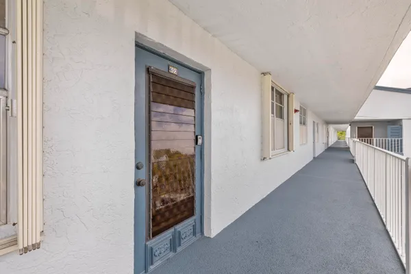 a view of a hallway with windows