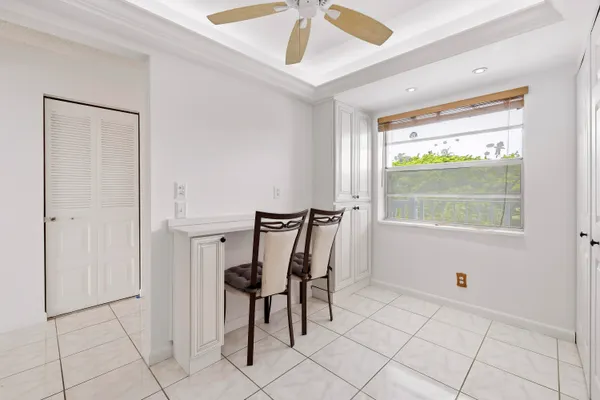 a kitchen with stainless steel appliances stove microwave and white cabinets