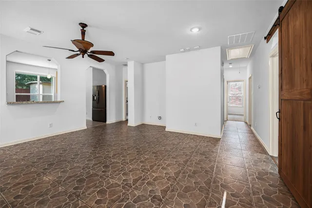 a view of a hallway with a chandelier