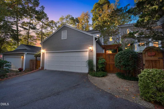a view of a house with a yard and garage