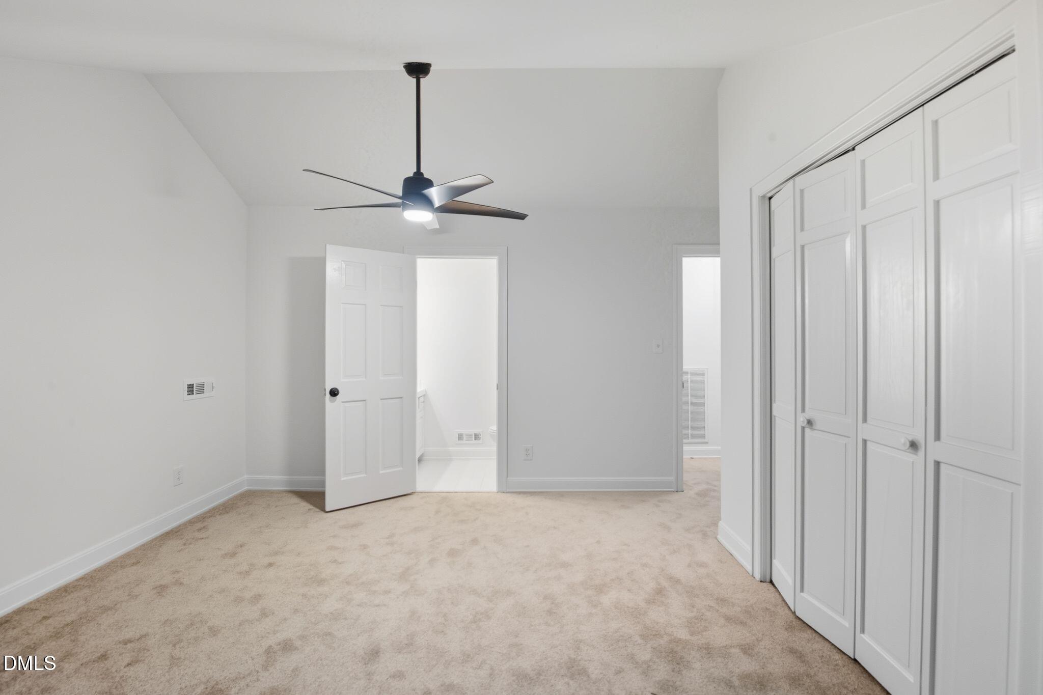 2205 Landings Way Raleigh, NC 27615 - Photo 17 of 35 a view of an empty room with a ceiling fan