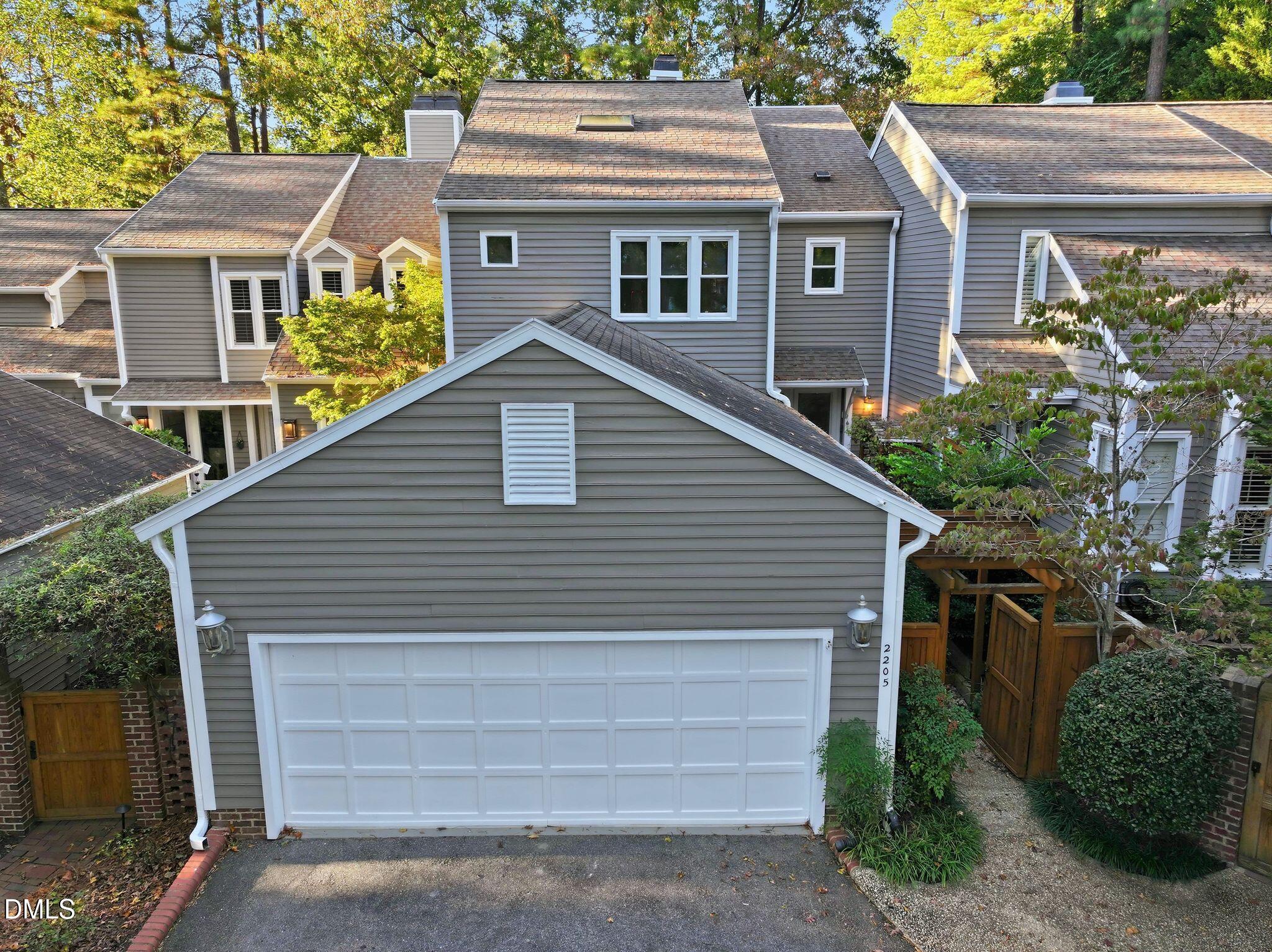 2205 Landings Way Raleigh, NC 27615 - Photo 2 of 35 a front view of a house with a garden