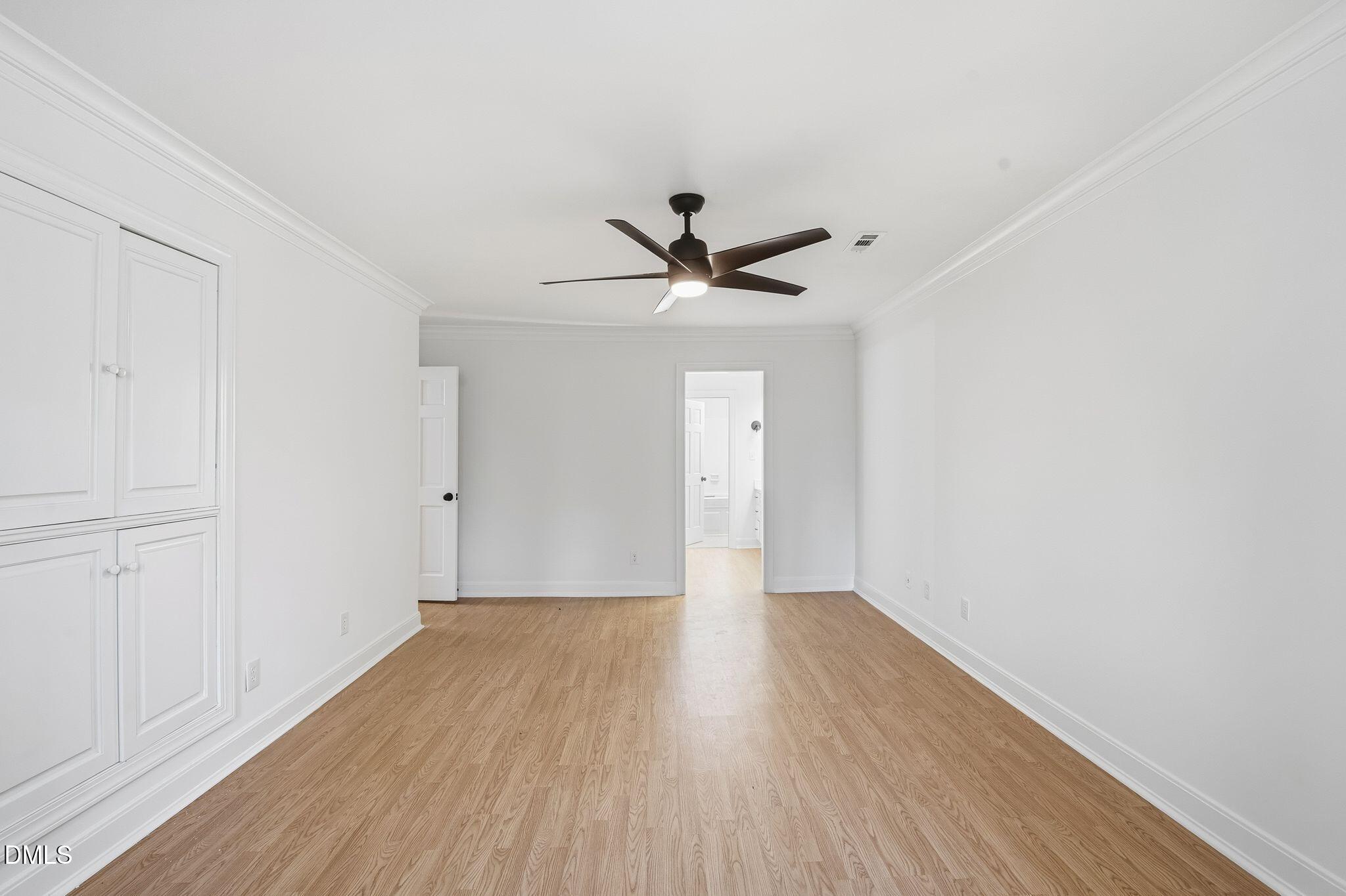 2205 Landings Way Raleigh, NC 27615 - Photo 25 of 35 a view of an empty room with wooden floor