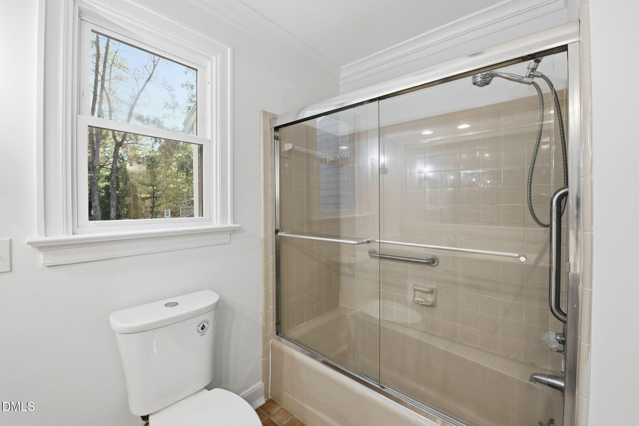 2205 Landings Way Raleigh, NC 27615 - Photo 27 of 35 a bathroom with a shower and toilet