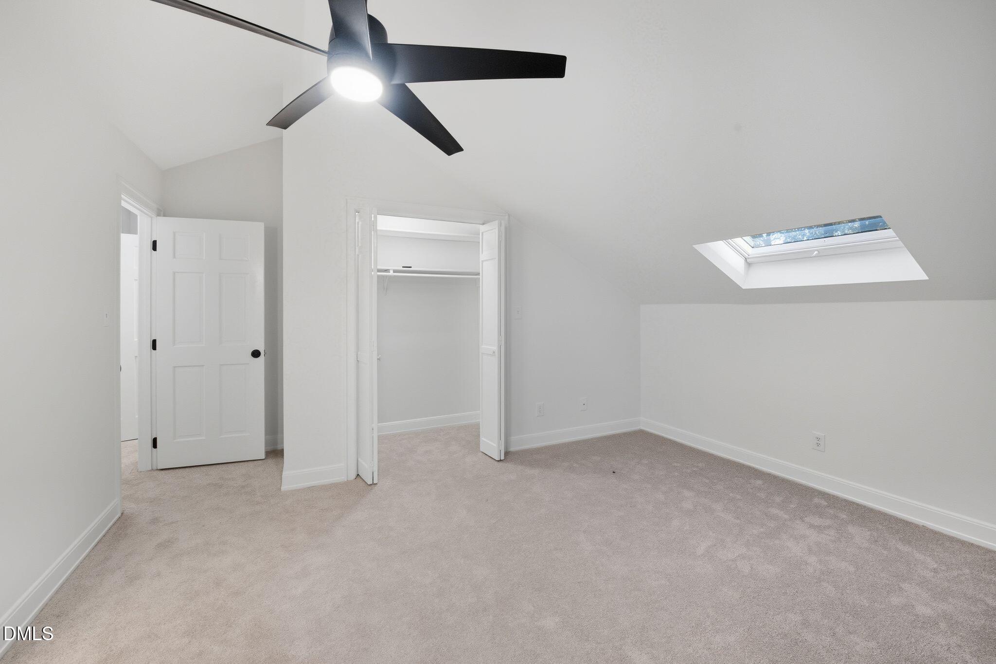 2205 Landings Way Raleigh, NC 27615 - Photo 28 of 35 an empty room with closet area and a chandelier fan