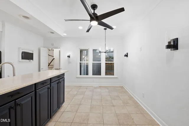 a view of a bathroom with a sink and a mirror