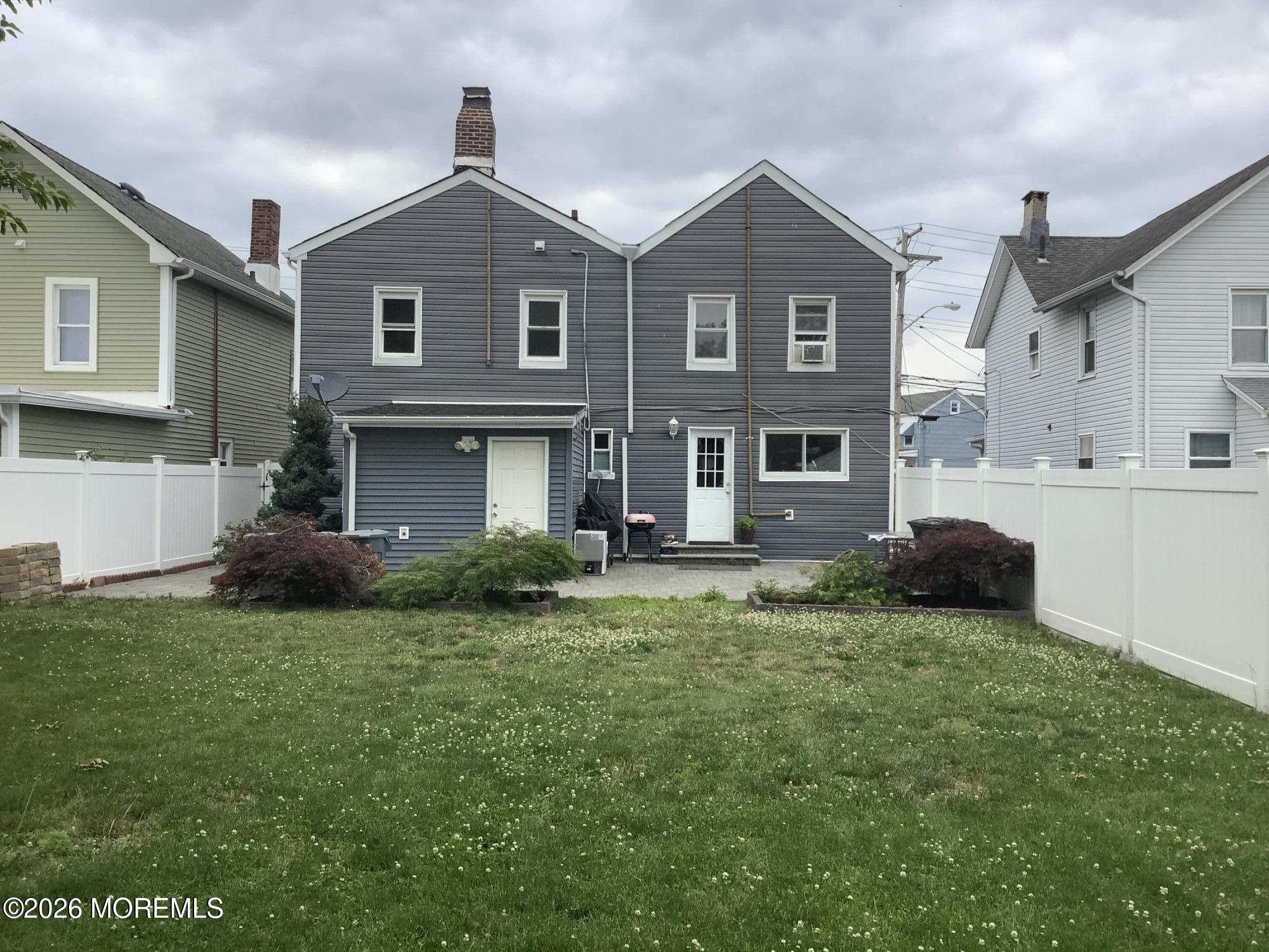 242 1st Street Keyport, NJ 07735 - Photo 5 of 23 a front view of a house with a garden