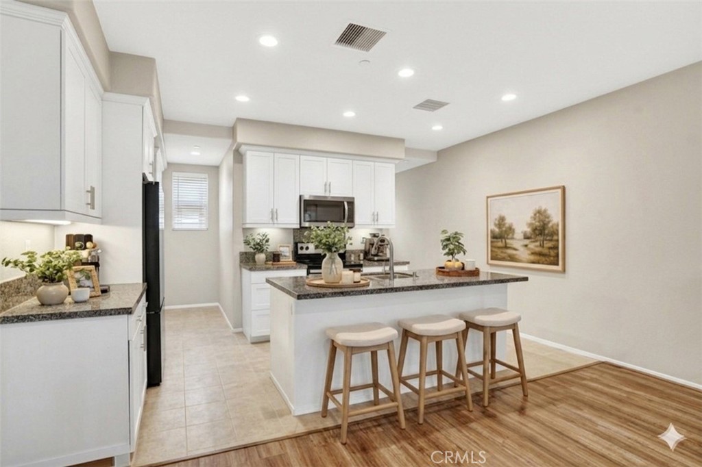 5869 Rostrata Avenue Buena Park, CA 90621 - Photo 4 of 29 Frame and bar stools virtually staged