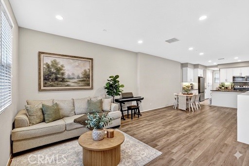 5869 Rostrata Avenue Buena Park, CA 90621 - Photo 8 of 29 Coffee table and frame virtually staged