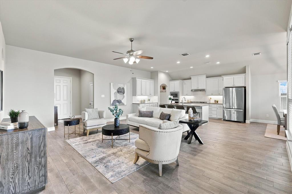915 Timber Ridge Drive Justin, TX 76247 - Photo 6 of 34 Open-concept living area featuring wood-finish flooring, recessed lighting, and a ceiling fan