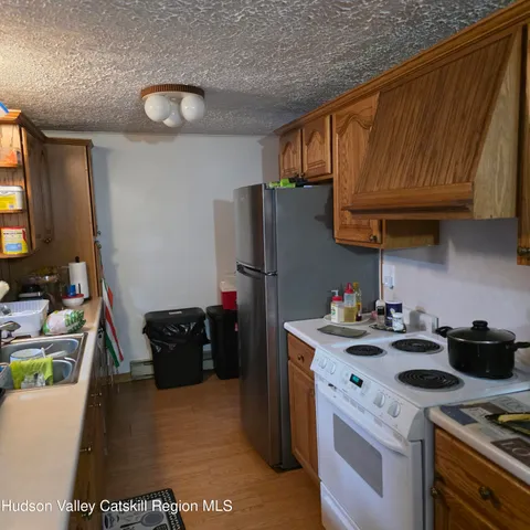 a kitchen with a stove and a refrigerator