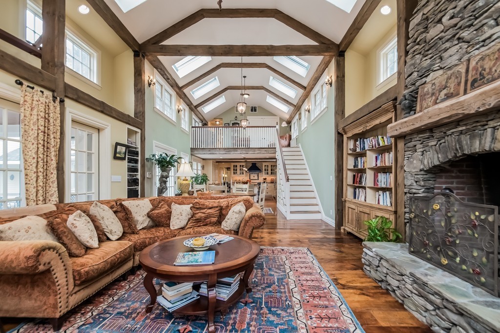 489 Bay Road Hamilton, MA 01982 - Photo 14 of 30 a living room with furniture a fireplace and a chandelier