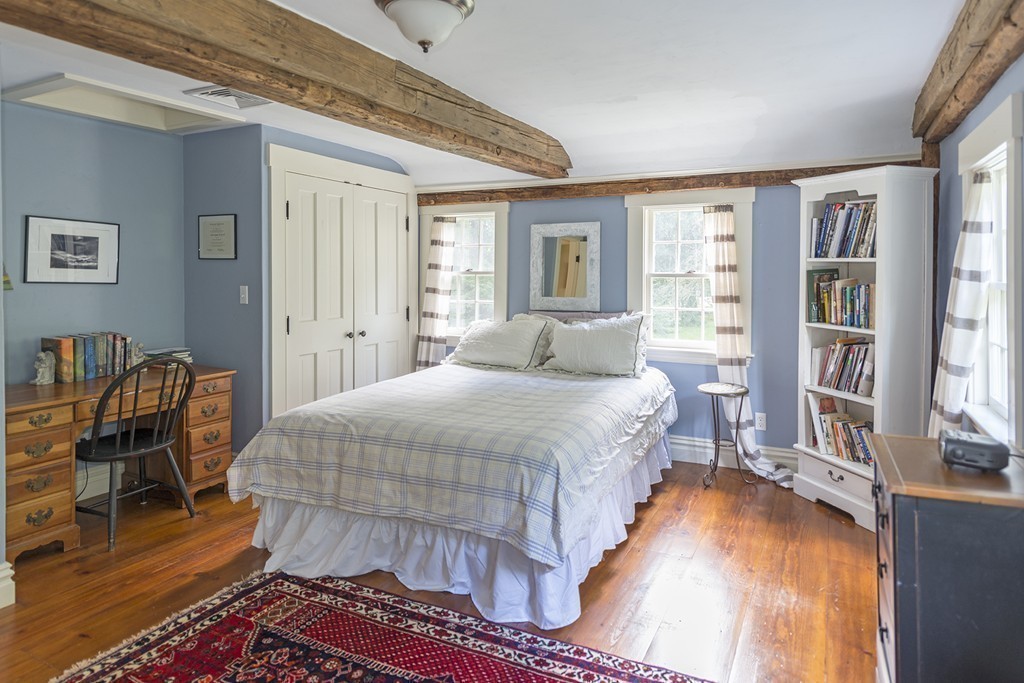 489 Bay Road Hamilton, MA 01982 - Photo 21 of 30 a bedroom with a bed and wooden floor