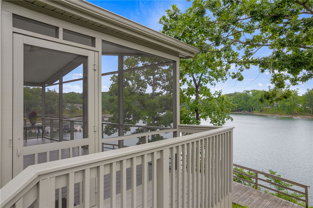 1230 Melton Road, Unit 30 West Union, SC 29696 - Photo 1 of 42 Lakeside living defines this screened-in porch with captivating water views.