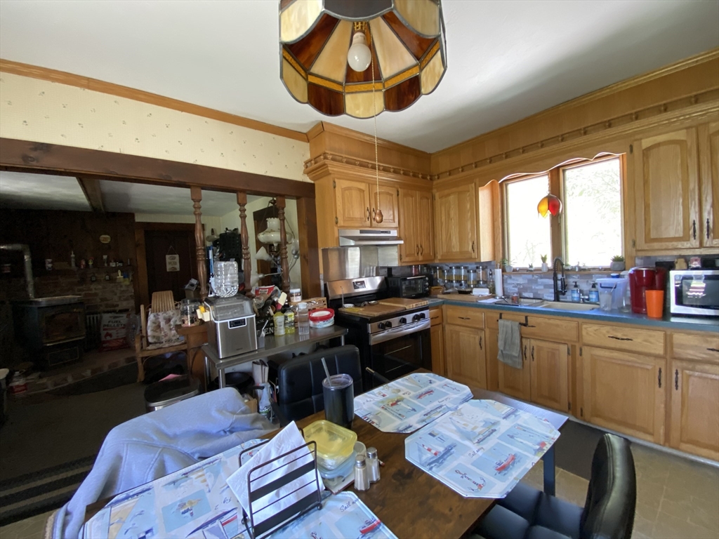 109 Brookfield Road Brimfield, MA 01010 - Photo 11 of 19 a kitchen with a dining table and chairs