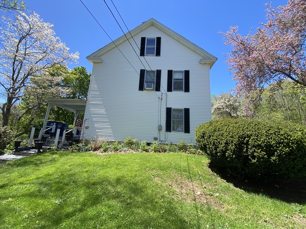 109 Brookfield Road Brimfield, MA 01010 - Photo 4 of 19 a front view of a house with a yard