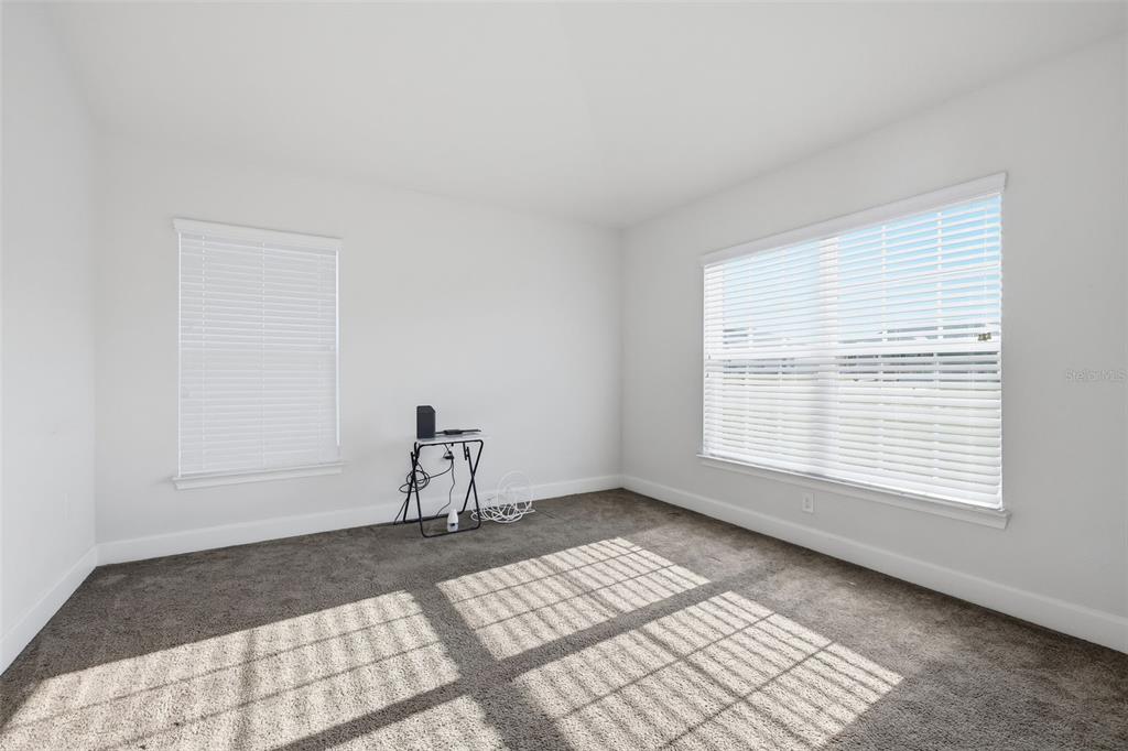 9144 Southeast 47th Court Road Ocala, FL 34480 - Photo 13 of 32 a room with a window and a table