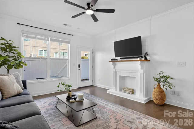 a bedroom with a bed and a computer on a table
